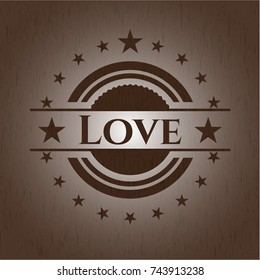 Love badge with wooden background