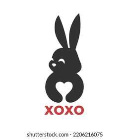 Love bunny icon. Rabbit heart hug logo mark. Negative space valentines day conceptual symbol. Cute xoxo kawaii animal friendship emblem. Vector illustration.