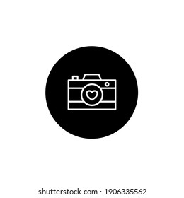 Love camera icon in black round style. Love and affection icon