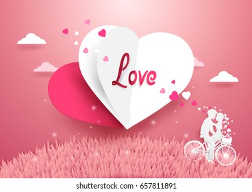 Love concept background. White and Red Heart flying over grass with Sweet couple on bicycle