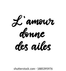 Love gives wings text in French language. Inspirational phrase. Calligraphic hand lettering motivational inscription in black and white colors for postcard, poster, wallpaper. Vector illustration.
