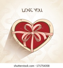 Love greeting card with knitted red heart pillow in gift box