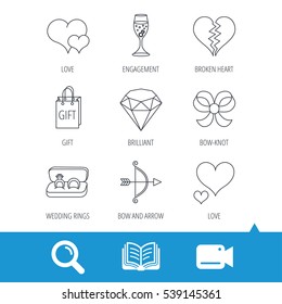 Love heart, gift box and wedding rings icons. Broken heart and engagement linear signs. Valentine amour arrow, brilliant flat line icons. Video cam, book and magnifier search icons. Vector
