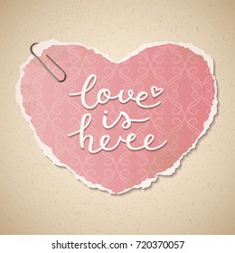 love is here lettering, vector handwritten text on vintage wallpaper heart