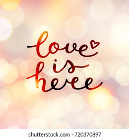 love is here lettering, vector handwritten text on lights