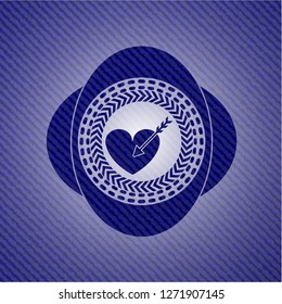 love icon inside badge with denim background