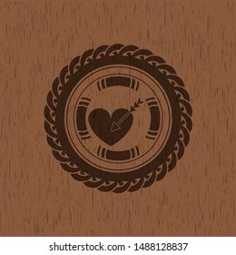 love icon inside badge with wood background