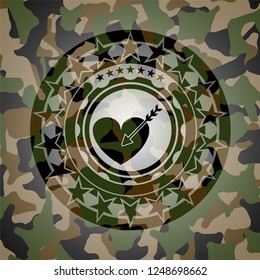 love icon inside camouflage emblem