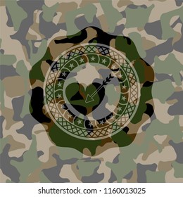 love icon inside camouflaged emblem