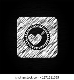 love icon inside chalkboard emblem written on a blackboard