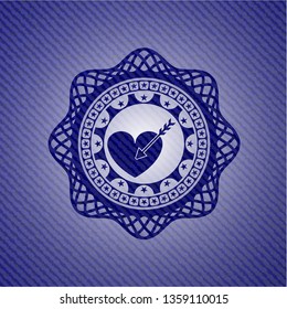 love icon inside emblem with denim texture