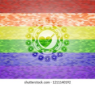 love icon inside emblem on mosaic background with the colors of the LGBT flag