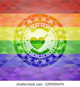 love icon inside emblem on mosaic background with the colors of the LGBT flag