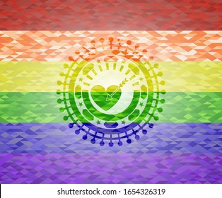 love icon inside emblem on mosaic background with the colors of the LGBT flag