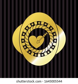 love icon inside golden emblem