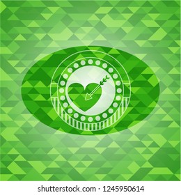 love icon inside green emblem with mosaic ecological style background
