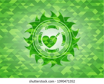 love icon inside green emblem. Mosaic background