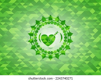 icono de amor dentro del emblema del mosaico verde. 