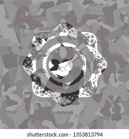 love icon inside grey camouflage emblem