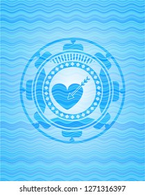 love icon inside light blue water wave badge.