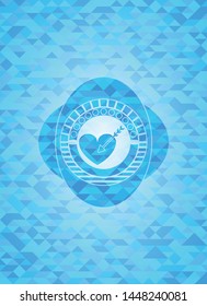 love icon inside light blue emblem with mosaic background