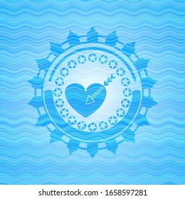 love icon inside light blue water style badge.