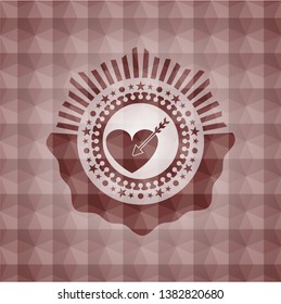 love icon inside red seamless geometric badge.
