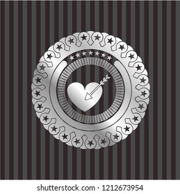 love icon inside silver emblem