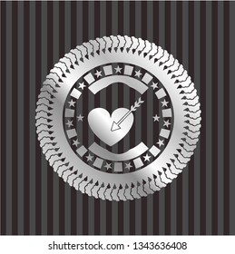 love icon inside silver emblem or badge