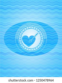 love icon inside sky blue water emblem.