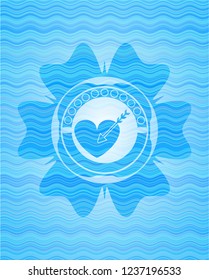 love icon inside water emblem background.