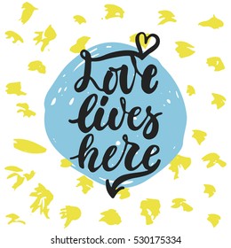 Love lives here - hand drawn lettering phrase isolated on the polka dot grunge background. Fun brush ink inscription for photo overlays, greeting card or t-shirt print, poster design.