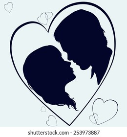 Love: man and woman silhouette in heart shape.