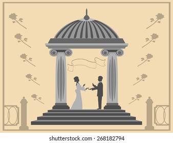 Love and marriage proposal young man gives a girl a ring standing in the gazebo.