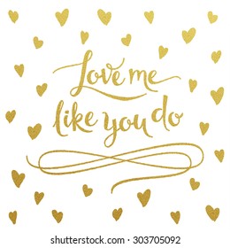 Love me like you do - gold glittering lettering design with hearts pattern on white background