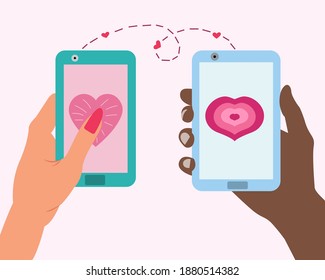 Love message on a smartphone. Send hearts by phone for valentine's day. A guy and a girl hold phones in their hands and congratulate each other on Valentine's Day.