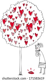 Love metaphor. Young woman near a love tree, looking at a fallen broken heart.