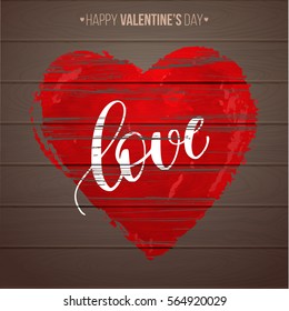 Love. Modern calligraphy style handwritten lettering with textured red heart on wooden background. Vector illustration for cards, leaflets or banners.