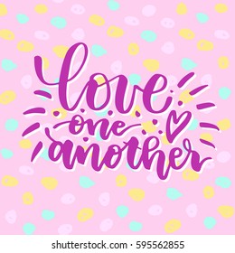 Love one another. Beautiful quote written by hand with a brush on a pink background in colorful bright circles. for card, invitation or poster. Lettering for Valentine's Day or wedding.