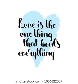 Love is the one thing that heals everything handwritten lettering. Love slogan. Modern vector hand drawn calligraphy with brush painted heart texture isolated on white background for your design