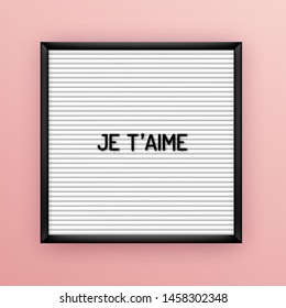 Love quote on square white letterboard with black plastic letters. Hipster vintage inspirational poster 80x, 90x. Je taime