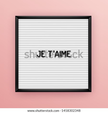 Love quote on square white letterboard with black plastic letters. Hipster vintage inspirational poster 80x, 90x. Je taime