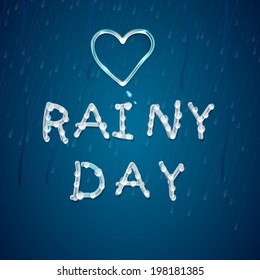 Love Rainy Day concept with glossy heart shape and shiny text on wet blue background. 