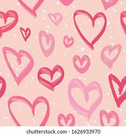 Love romantic seamless pattern with hand drawn hearts. Valentine's day background with colorful heart shapes on pink backdrop. Doodle style illustration. Repeat design for decor, textile, print, wrap