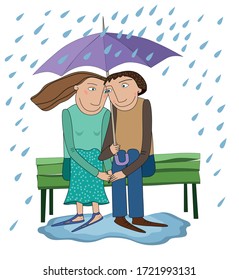 
In love sitting on a bench under an umbrella in the rain