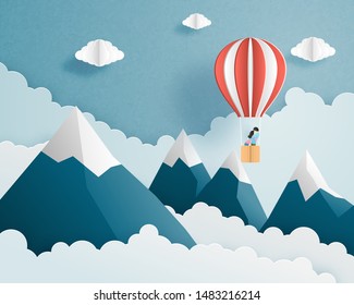 Love to travel banner, poster, invitation card concept. Origami made couple in hot air balloon flying on clouds and sky over mountain background and space. Vector illustration paper cut style.