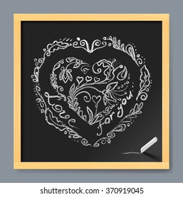 Love typographical message on the chalk board in heart