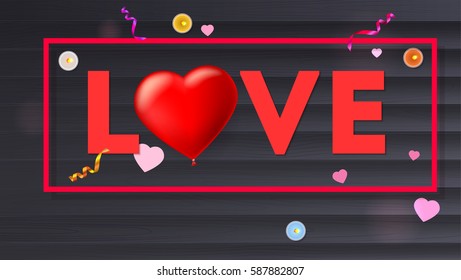 Love typography, large red heart in the form of an inflatable, scarlet balloon. Top view, composition with candles, tinsel and confetti on black wooden background. Template for creative persons