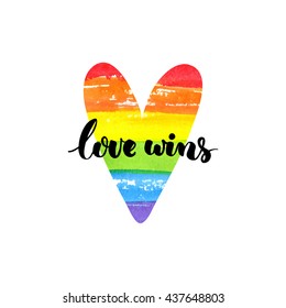 Love wins. Inspirational quote. Brush lettering on rainbow watercolor heart. Symbol of gay marriage, rights equality