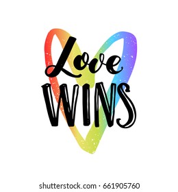 Love wins. Inspirational quote on rainbow heart, LGBT pride slogan for t-shirt, posters and cards.